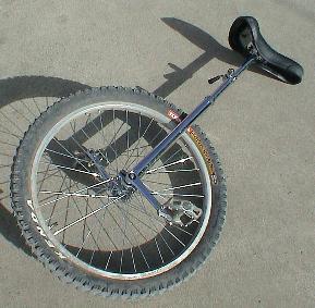 Picture of unicycle lying on cement